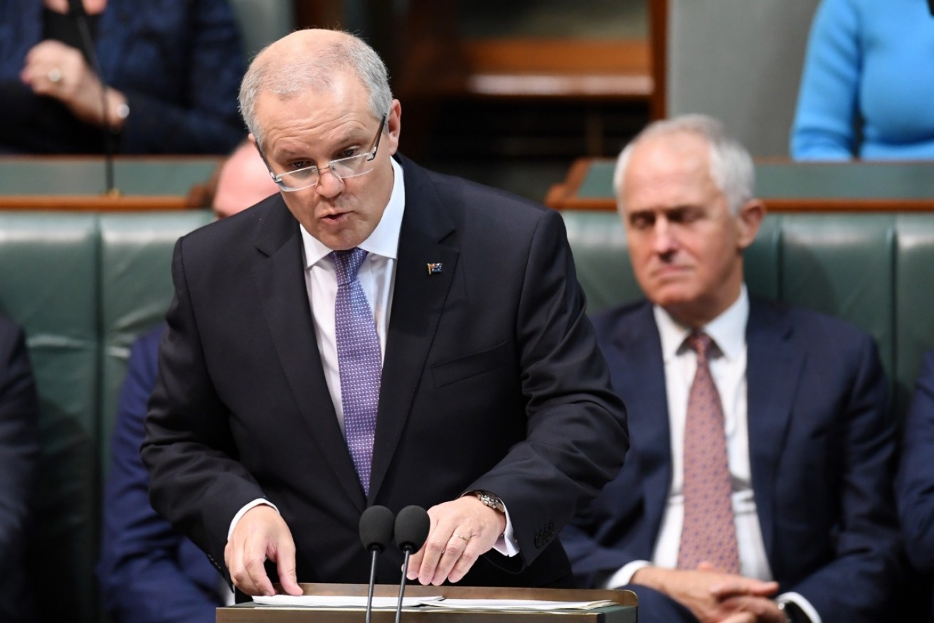 Mr Turnbull and Mr Morrison bury the legacy of the 'Abbott-Hockey' 2014 political fiasco. Photo: AAP