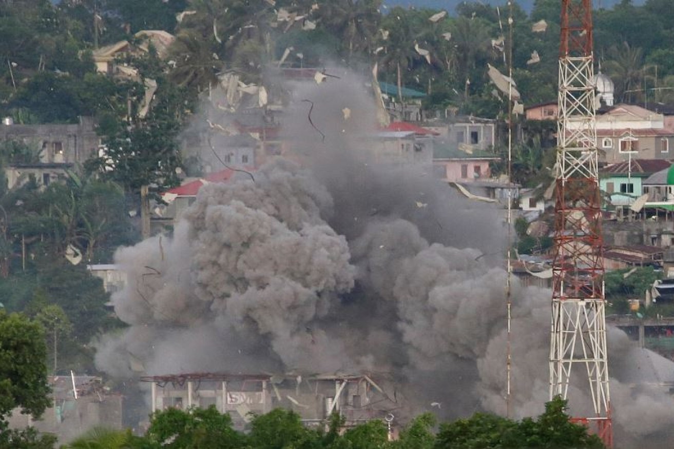 A pall of smoke rises from a Philippine Air Force strike on a suspected ISIS bunker in Marawi.