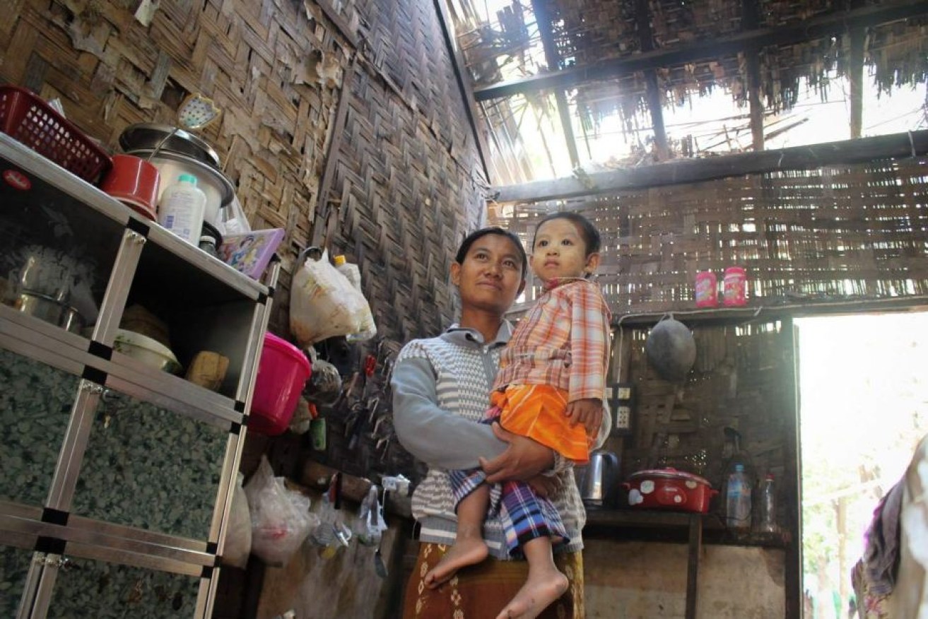 Garment worker Ma Thae Thae Mar was forced to choose between roof repairs and childcare.