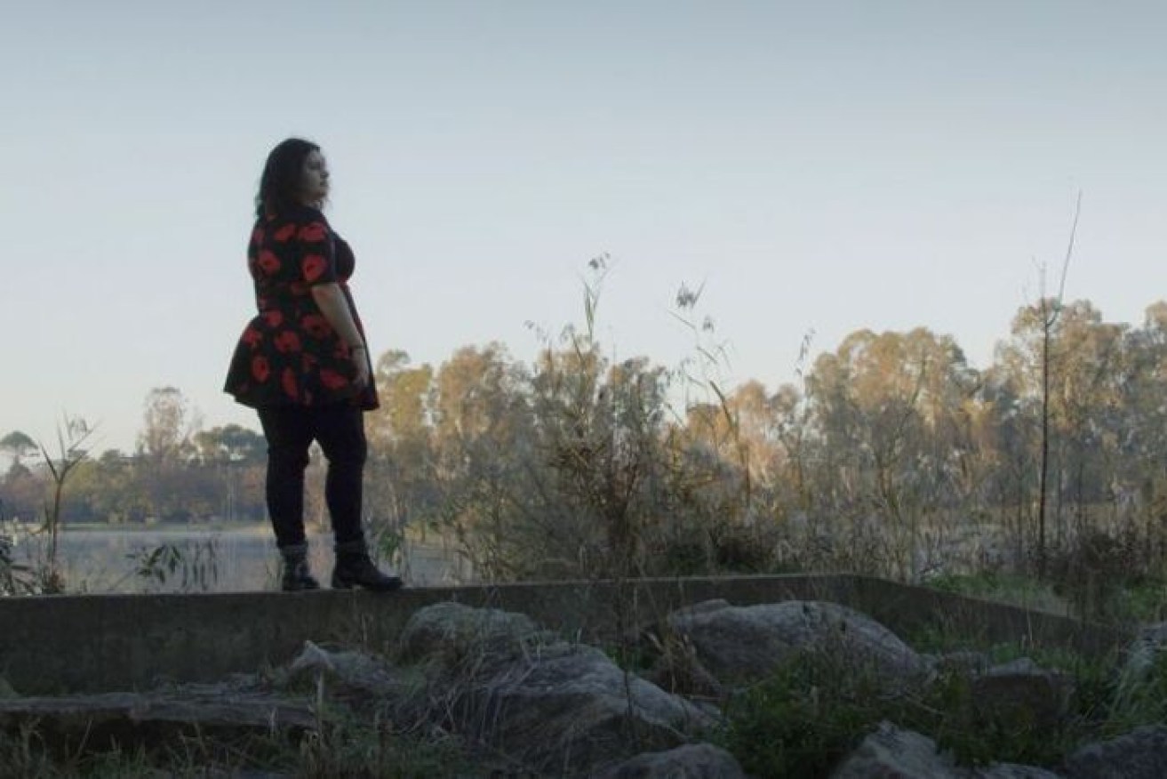 Isobel Morphy-Walsh stands on the site of an Indigenous massacre.  