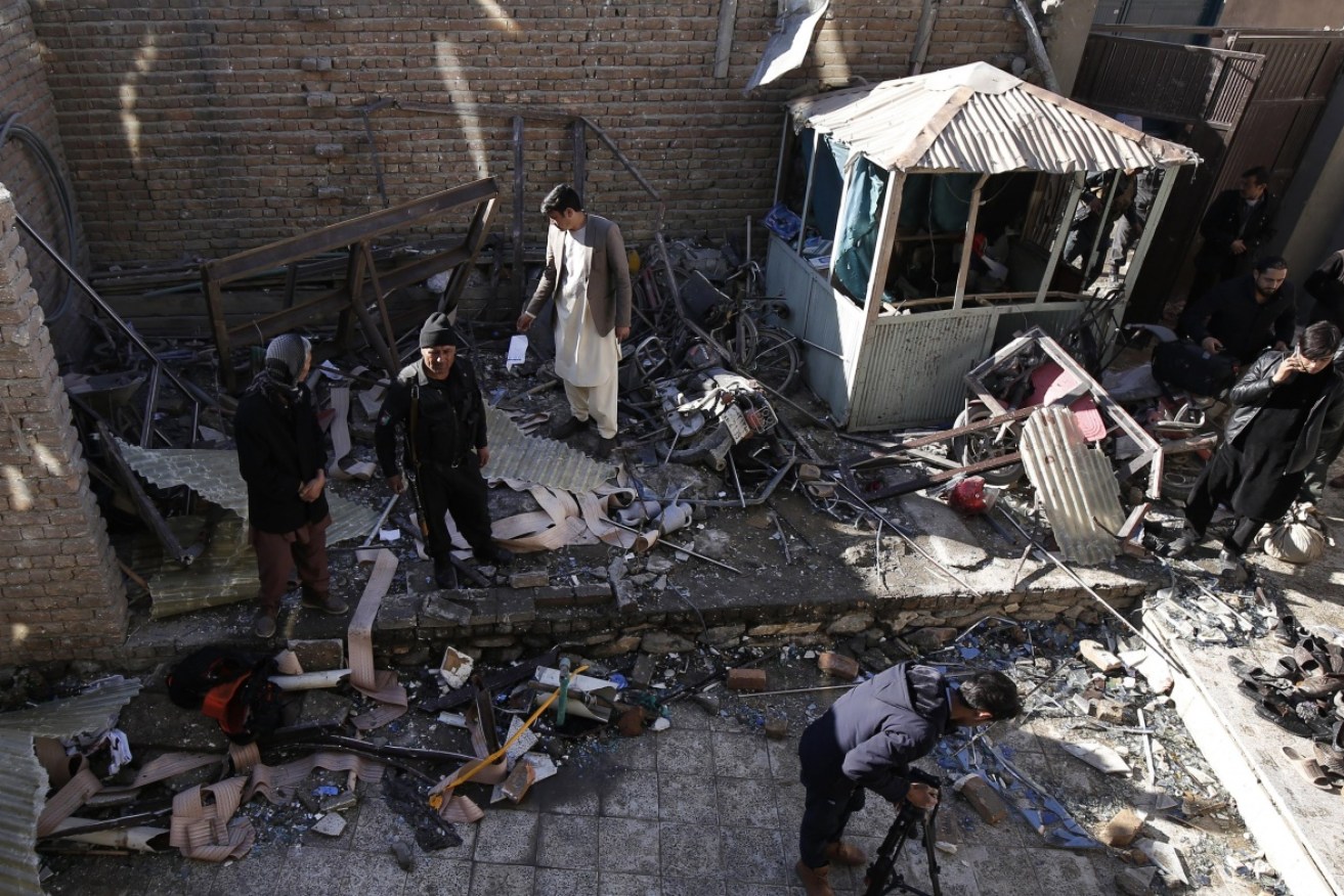 Four women and two children were killed and 84 wounded in three explosions at a Kabul cultural centre. 