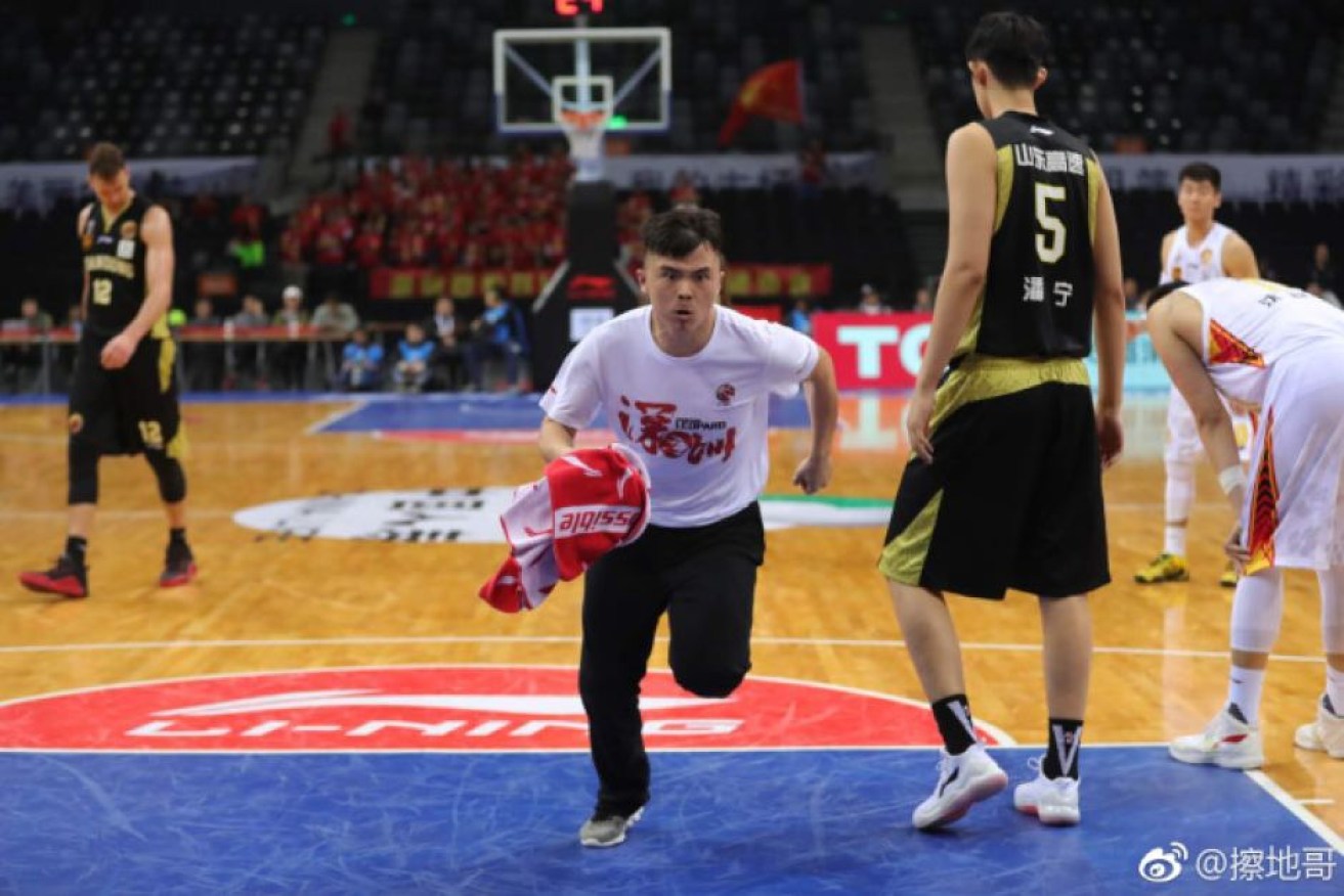 Meng Fei is a volunteer cleaner for the Chinese Basketball Association.