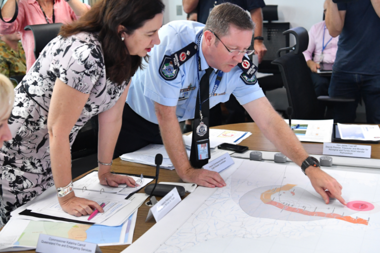 Premier Annastacia Palaszczuk gets a briefing from Police Deputy Commissioner Bob Gee about Nora's likely path.