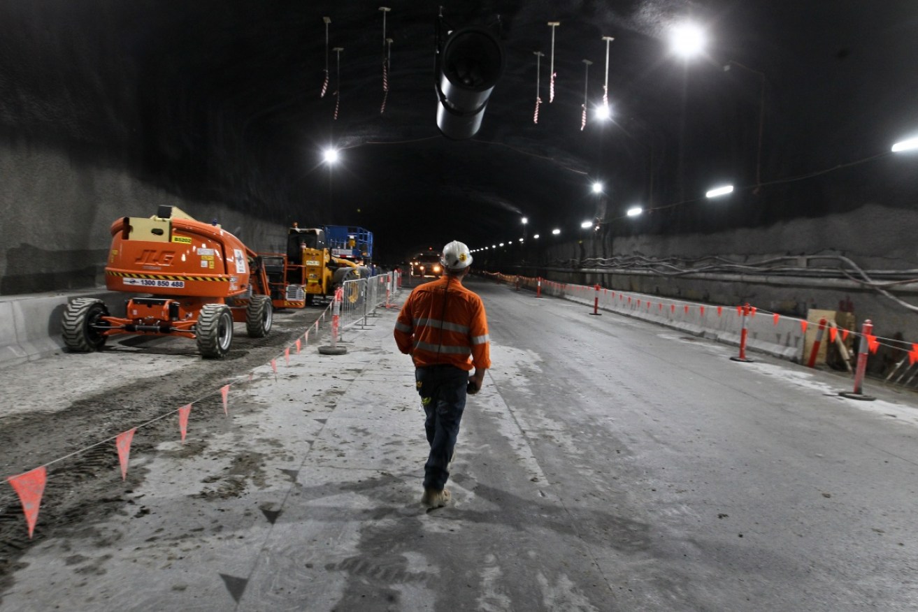 A construction worker is seen at a new stretch of tunnel for the WestConnex project in December last year.