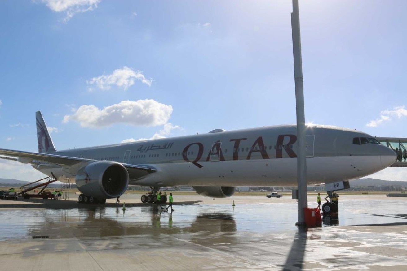 A case over strip searches can proceed against Doha's airport but not Qatar Airways, court ruled.
