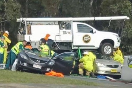 Airborne ute lands on three cars north of Brisbane after plunging from highway off-ramp