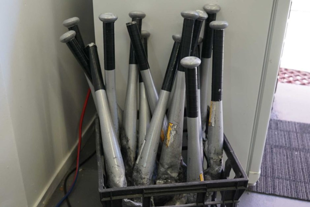 Bats ready and waiting for use in the break room at Smash Brothers.