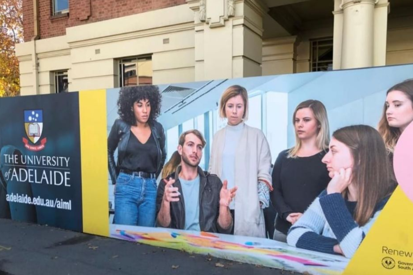 "No listen up, girls' - that's what the man at the centre of the controversial billboard appears to be saying.