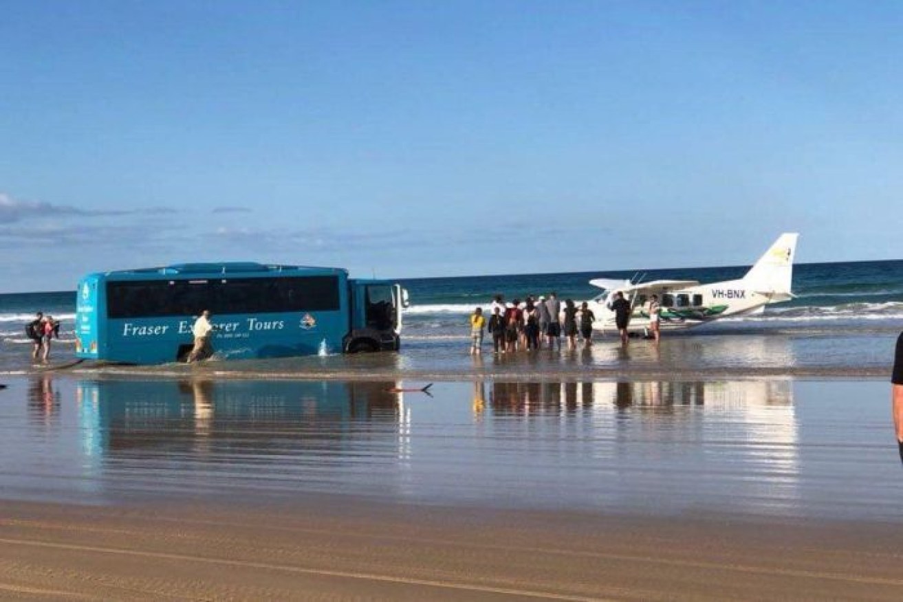The bus driver found himself stick in rising waters after trying to tow the plane.

