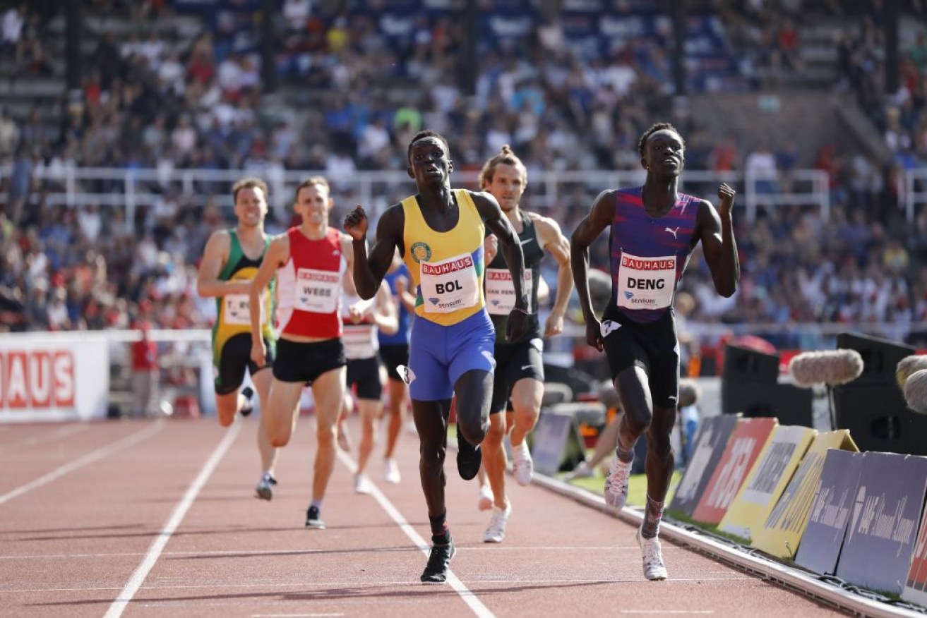 Peter Bol of Australia (centre) and Joseph Deng (right) in an 800m event in Sweden.