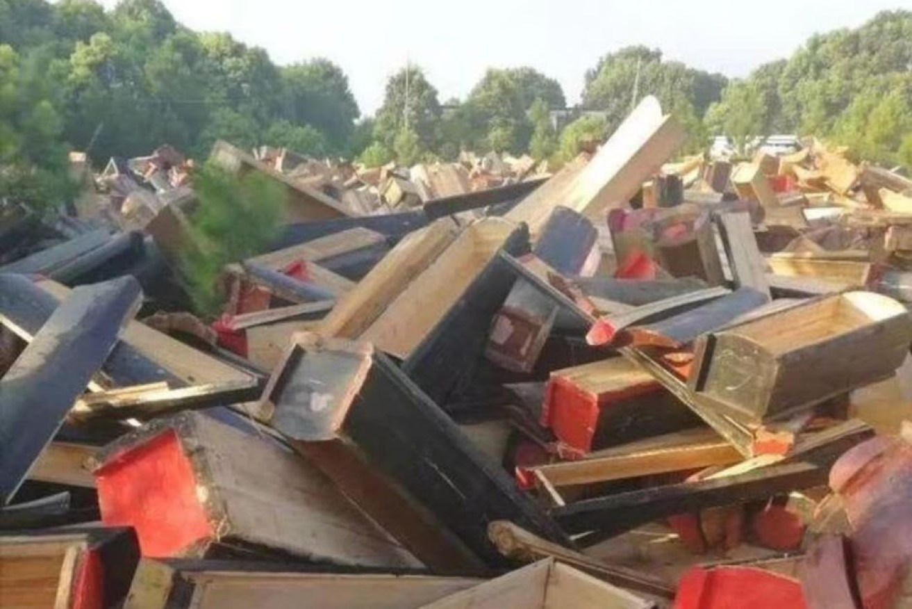 More than 5000 coffins were surrendered in Jiangxe last month, but not always voluntarily.

