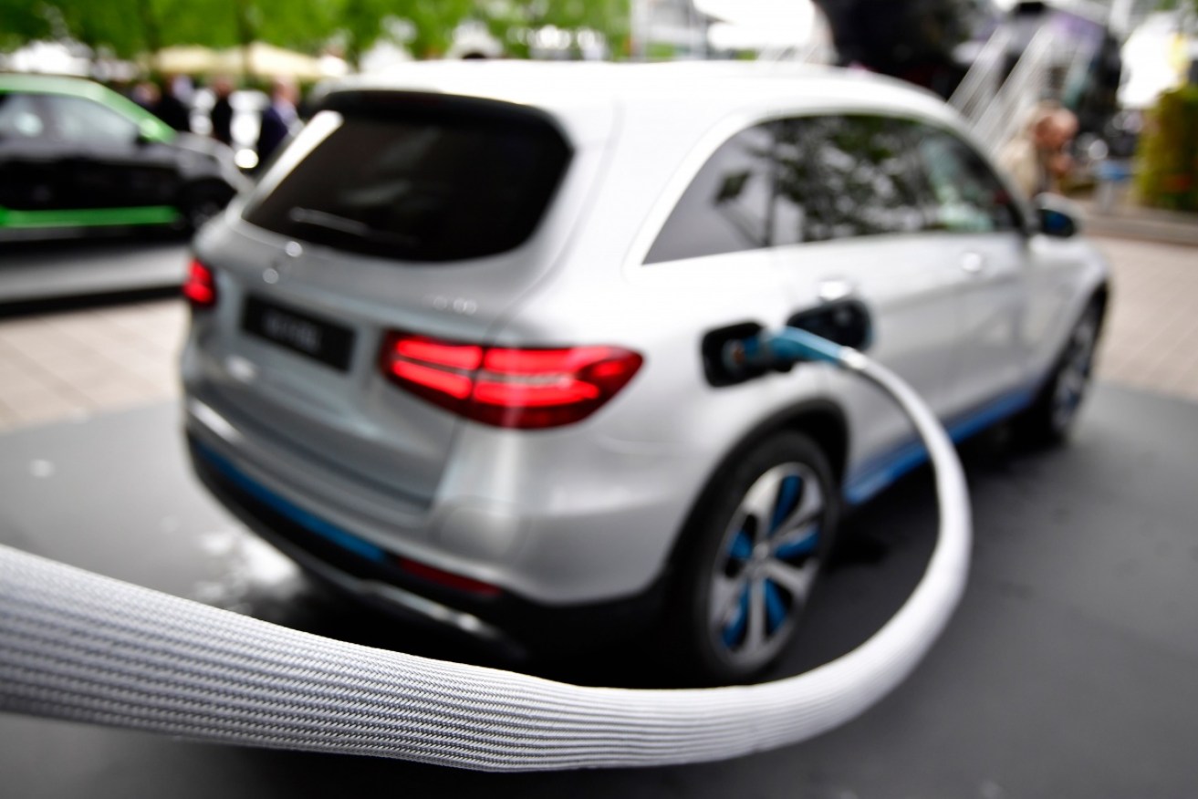 An SUV is refuelled qith hydrogen gas at the Frankfurt Auto Show.