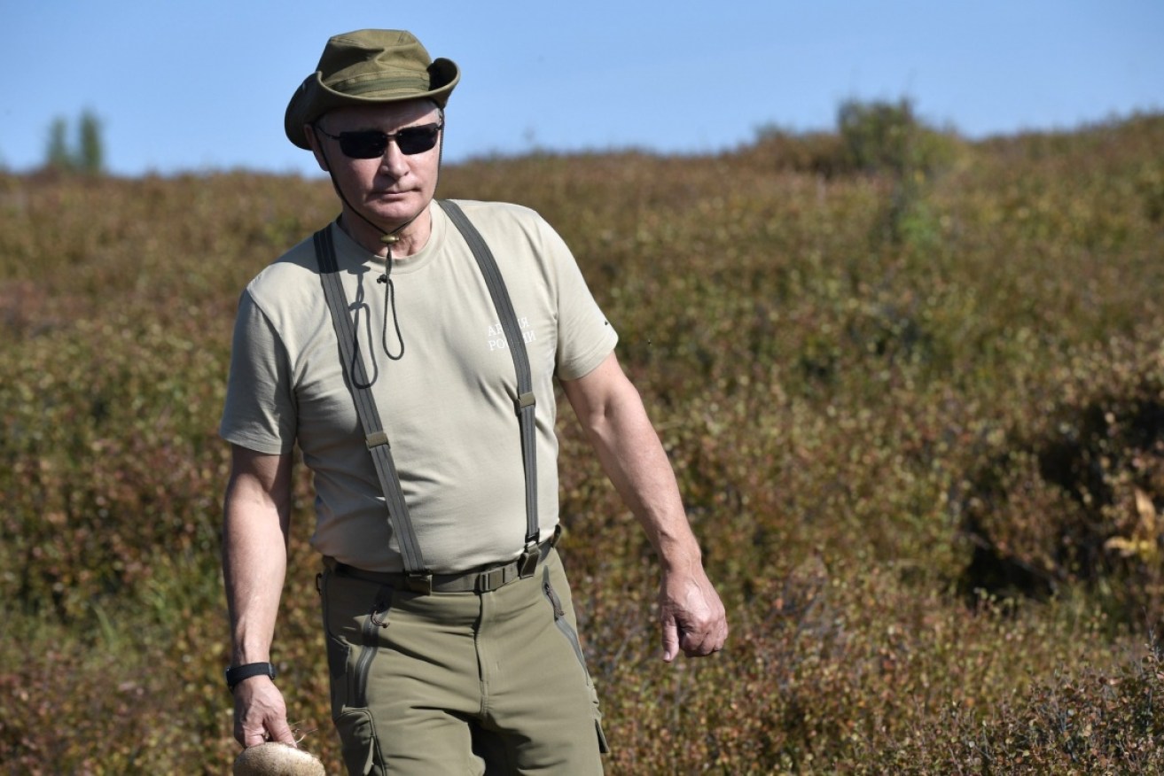 Russian President Vladimir Putin is ready for action on holiday in Siberia.