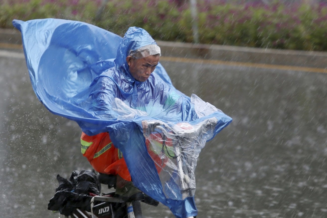 A cyclist braves the storm in Shenzhen, in China's Guangdong province.