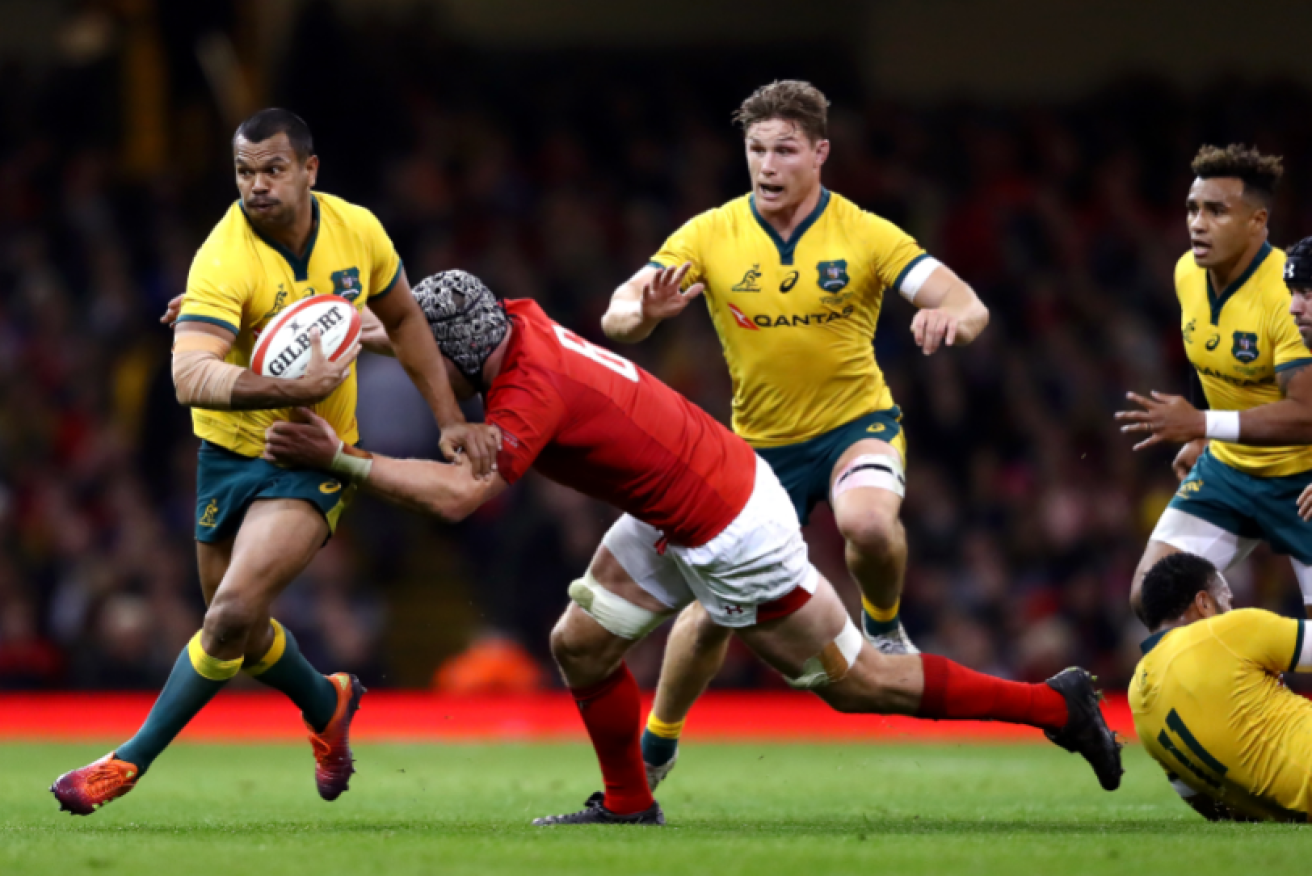 Kurtley Beale bursts through the Welsh defense before the Wallabies once again went down to defeat. 