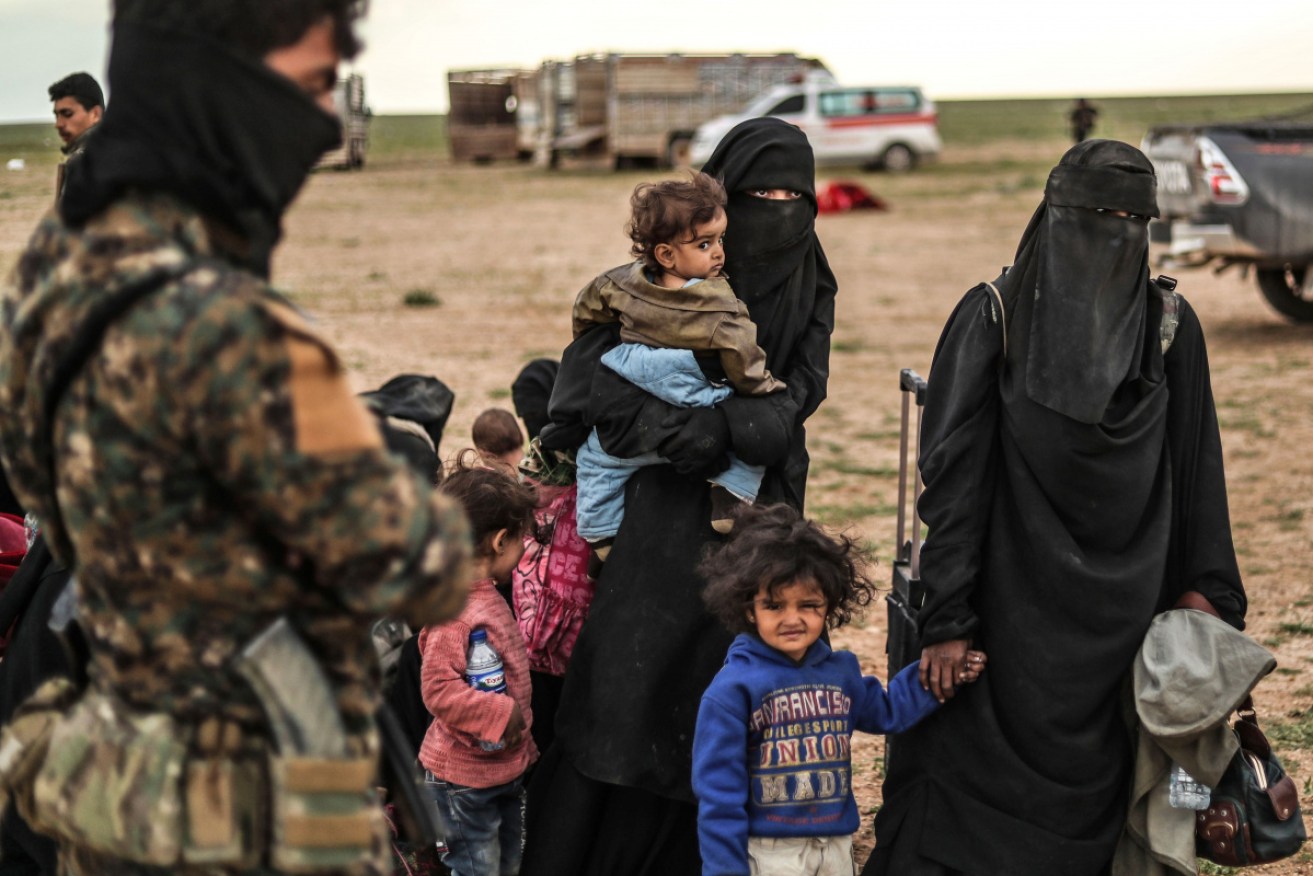 Civilians are evacuated from the IS stronghold of Baghouz in Syria on Wednesday. 