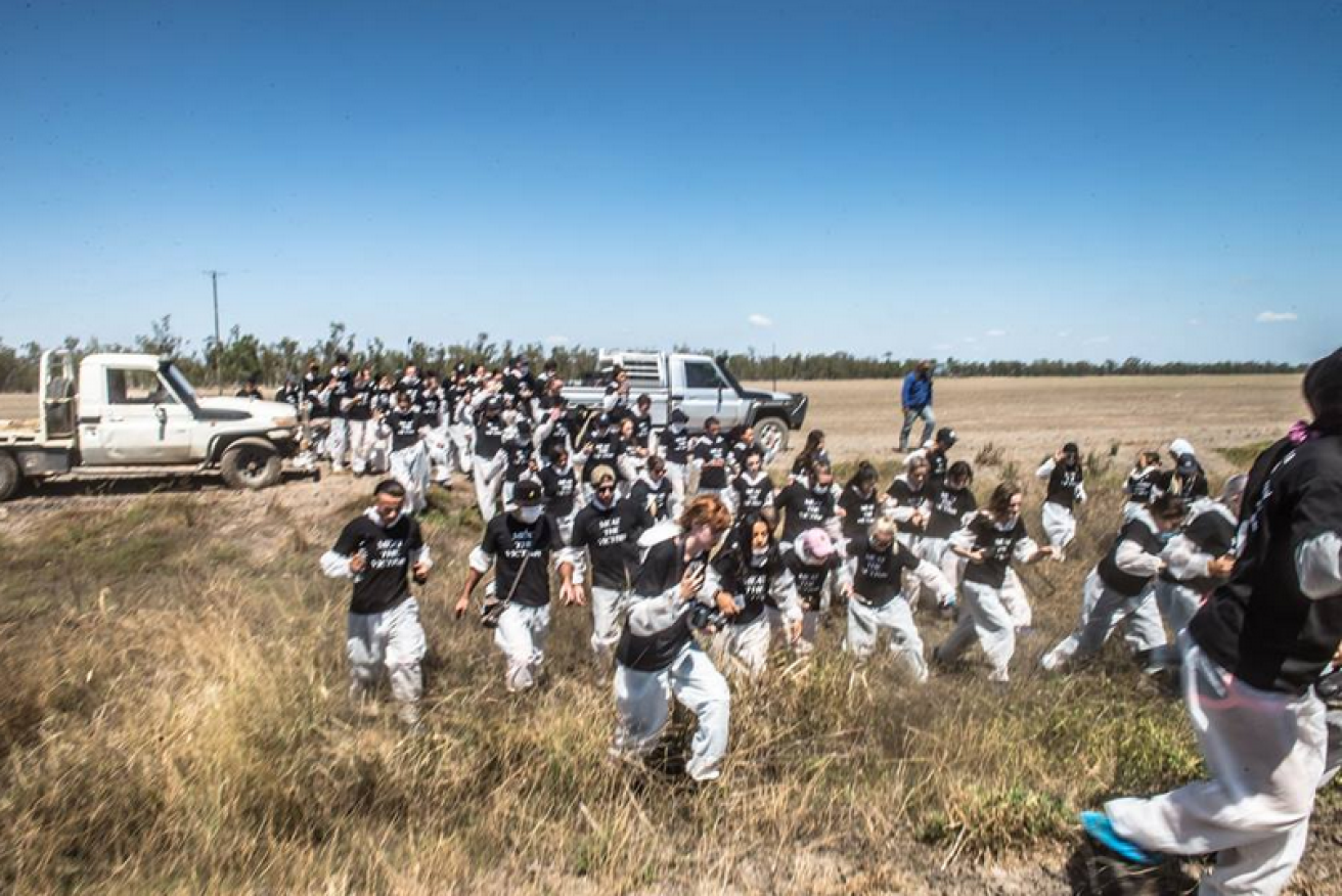 A uniformed army of  animal rights activists descends on a cattle feedlot in March, 2019. 