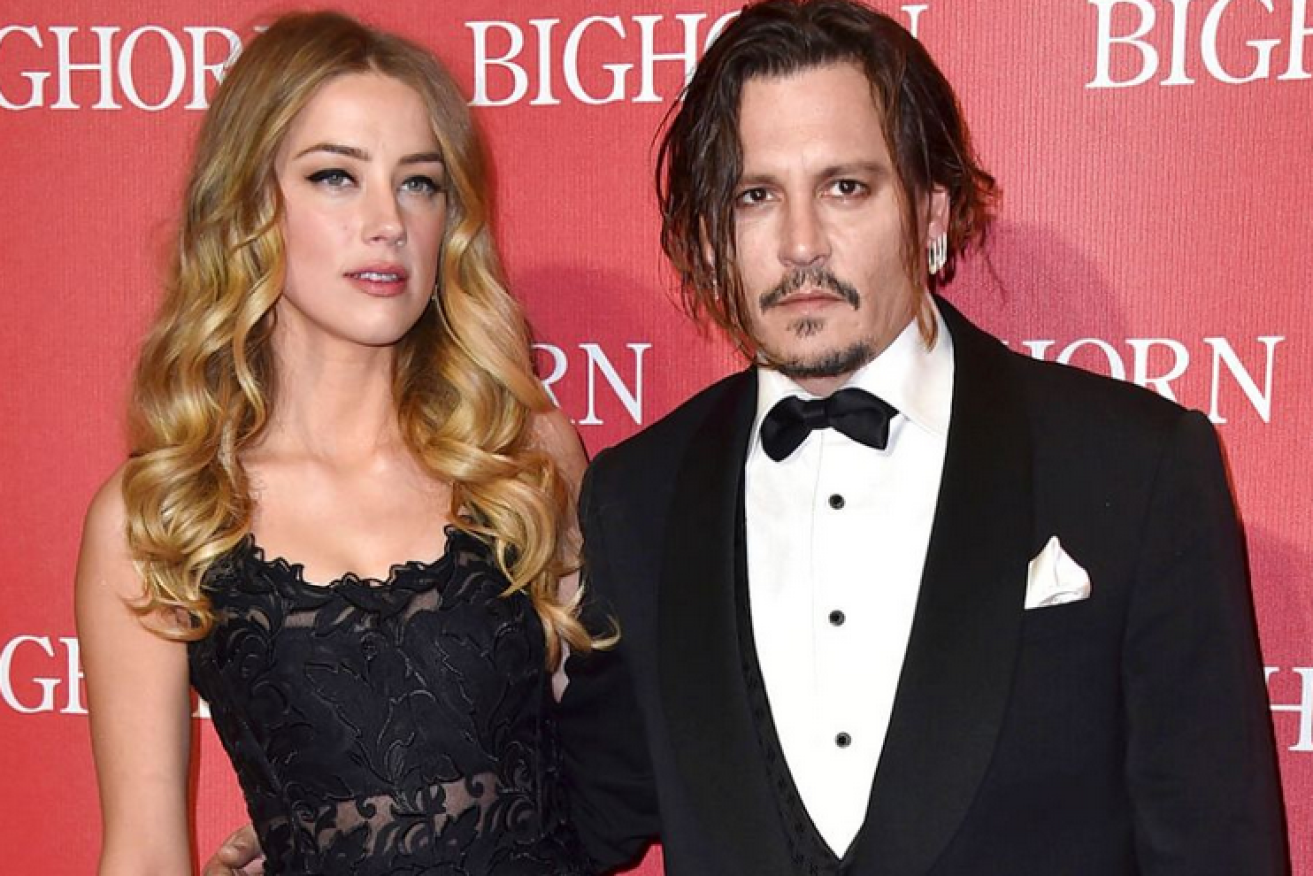 You'd never guess it from the sour look on both their faces but Johnny Depp and Amber Heard once claimed to be in love. Not anymore, that's for sure.