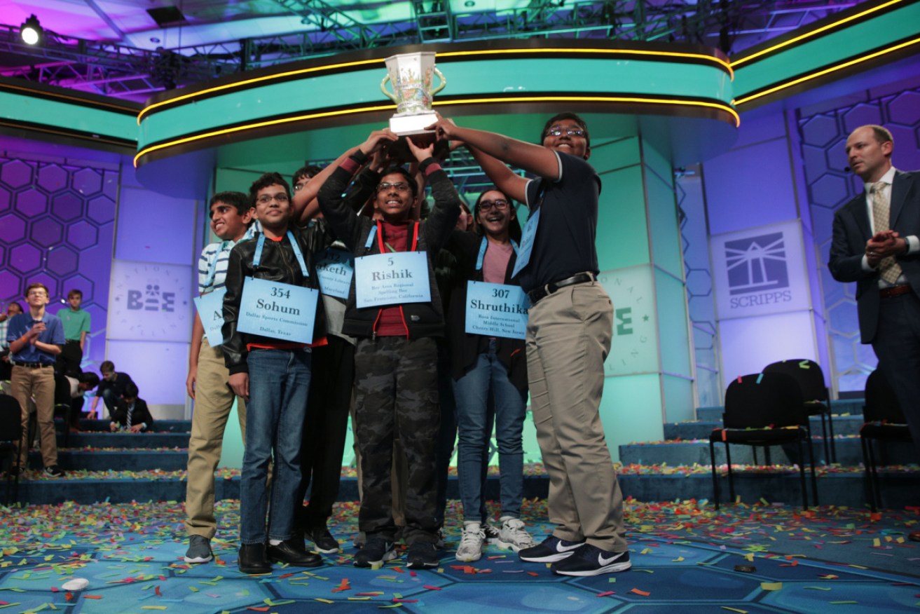 Co-champions from across the US hold up the one trophy (they'll get a Scripps cup each) after 20 rounds of competition. 