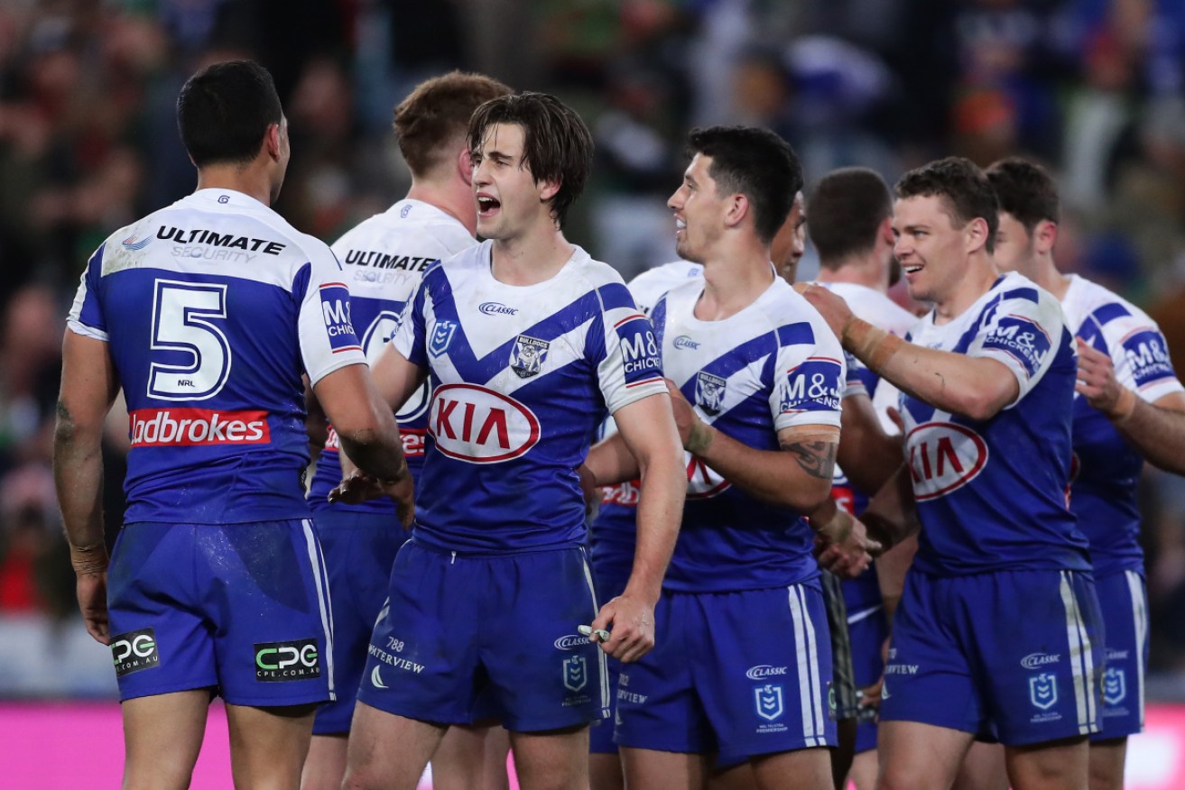 Danger side: The Bulldogs celebrate their win over the Rabbitohs.