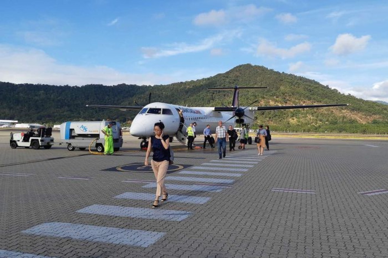 Passengers applauded the plane's safe landing back in Cairns.