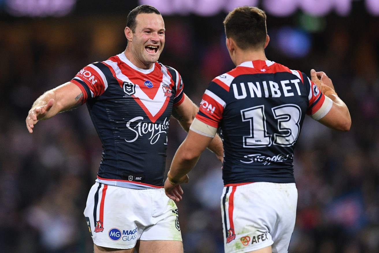 Boyd Cordner and Victor Radley of the Roosters celebrate at the end of the NRL Preliminary Final