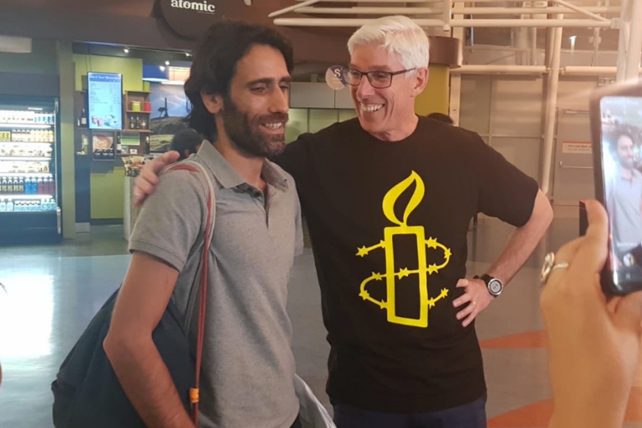 Behrouz Boochani leaves immigration at Auckland airport. <i>Video: ABC</i>