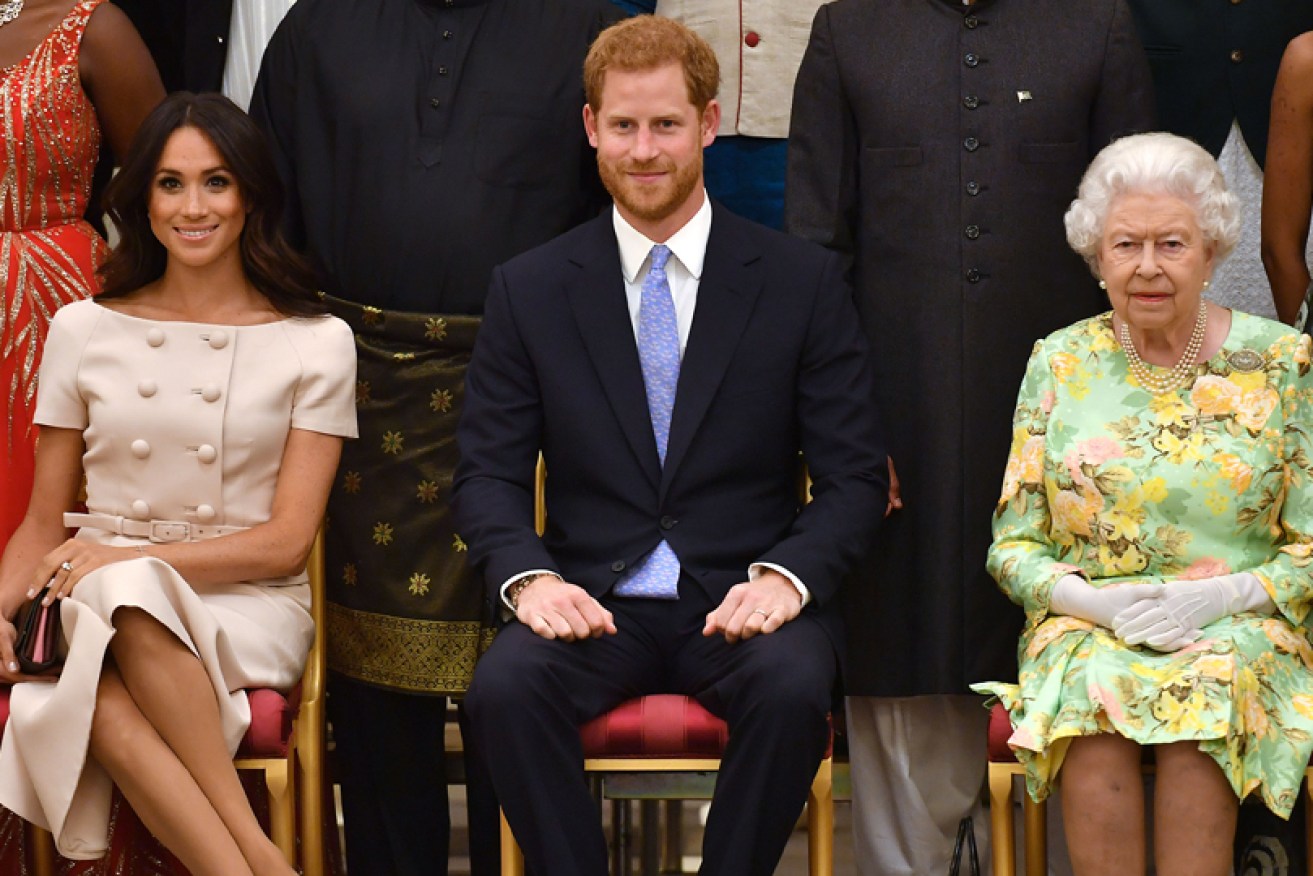 Meghan Markle, Prince Harry and Queen Elizabeth at Buckingham Palace in June 2018.