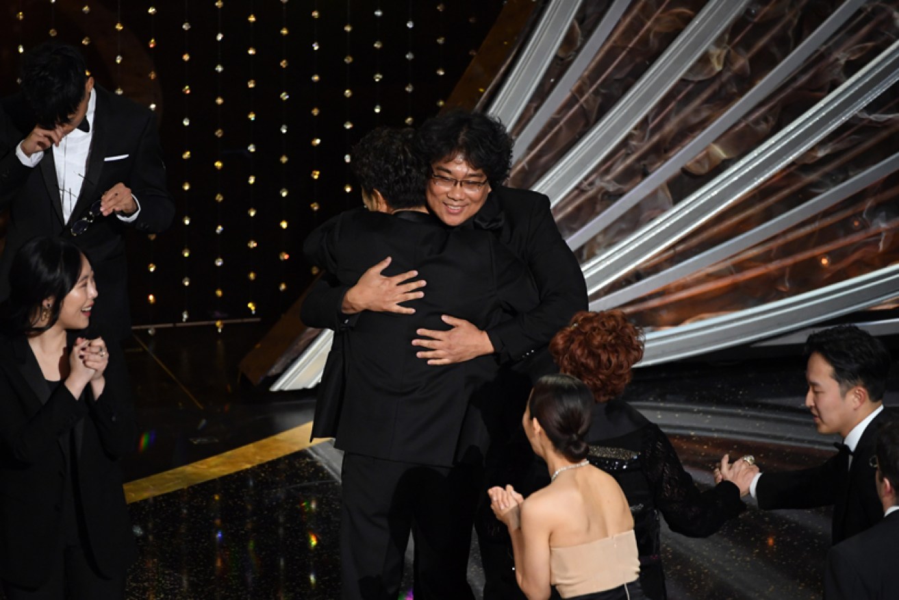 Bong Joon-ho celebrates <i>Parasite's</i> historic best picture win at the 92nd Academy Awards in Los Angeles.