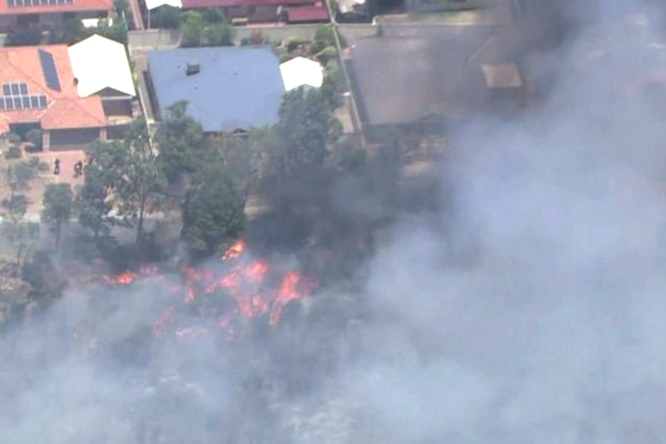 Aerial footage shows flames from the fire closing in on homes in High Wycombe.