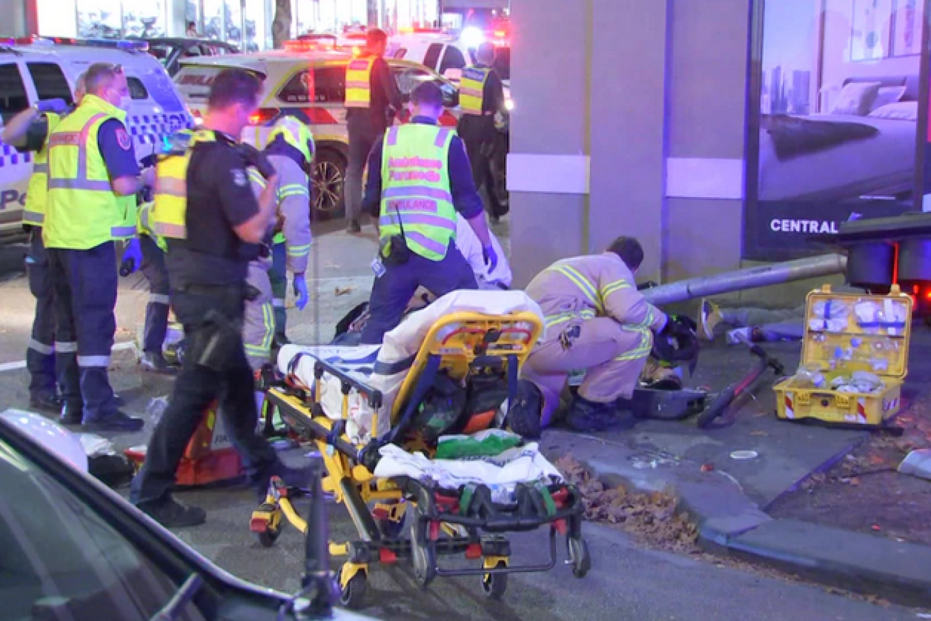 Paramedics and rescuers haul the injured from the fateful Southbank corner.