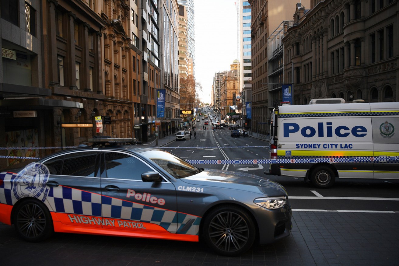Police work at the scene of the fatal shooting on Bridge Street, in the Sydney CBD.