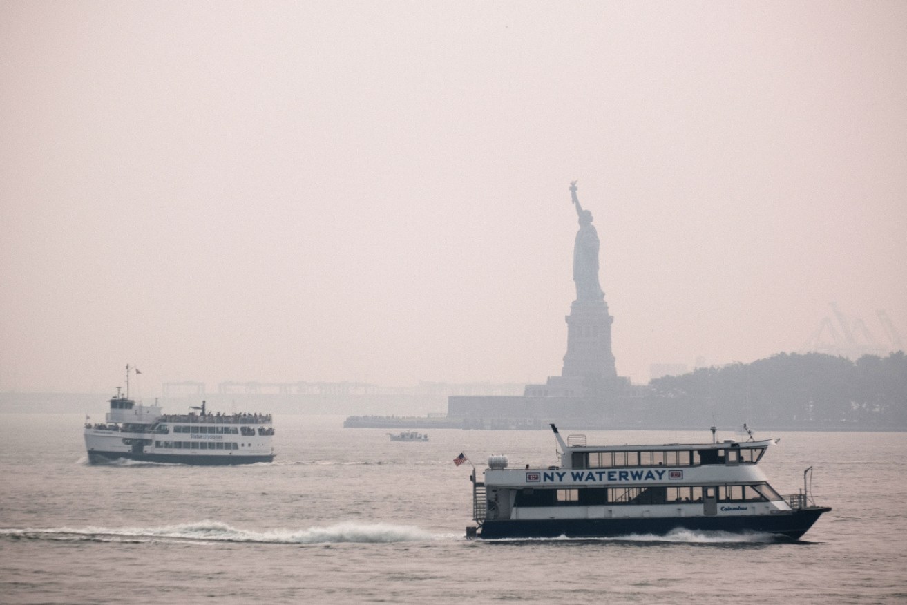 The Statue of Liberty is shrouded in smoke from fires in the US west.