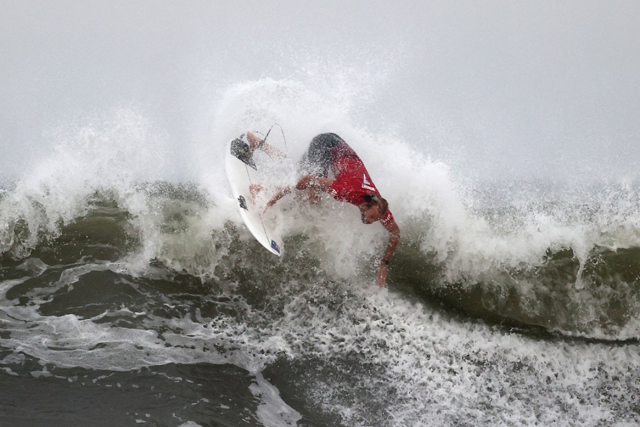 Australia's Owen Wright made the most of the storm-induced waves to push through to his quarter final.