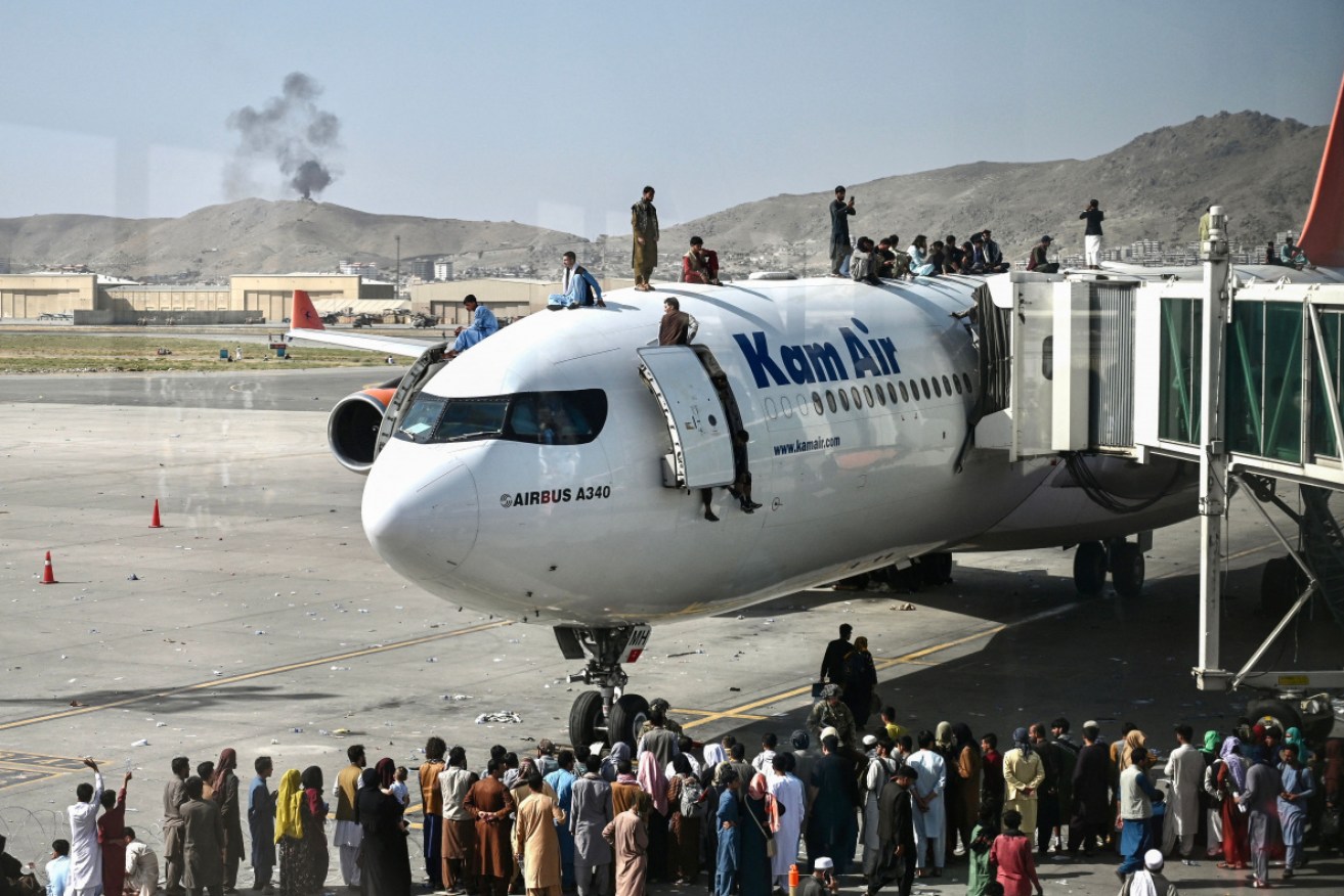 There were chaotic scenes at Kabul airport as people scrambled to flee the Taliban.