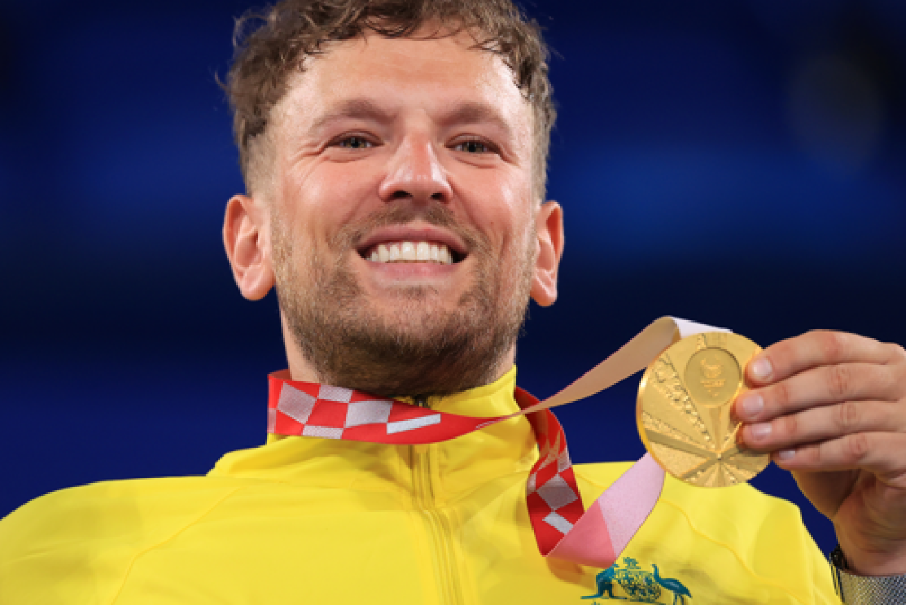 Dylan Alcott with his hard-won gold in Tokyo.