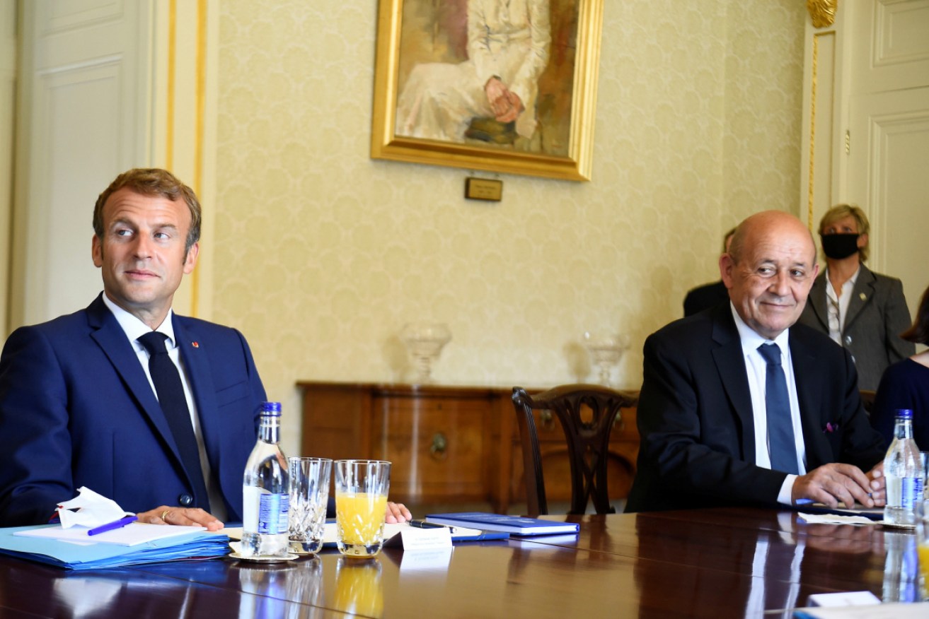 French President Emmanuel Macron (L) and Jean-Yves Le Drian visit Aras are angered by the Australian decision.