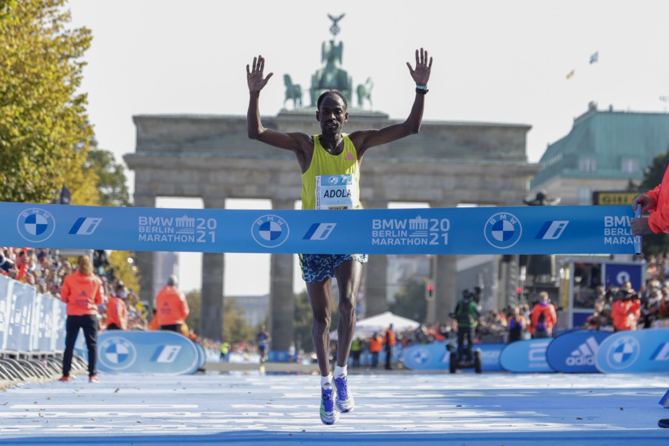 Ethiopia's Guye Adola has led home Bethwel Yegon and Kenenisa Bekele to win the Berlin Marathon. 