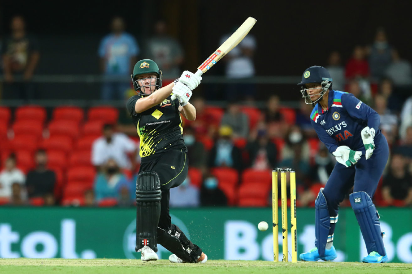 Australian debutante Tahlia McGrath swings for the boundary against India.