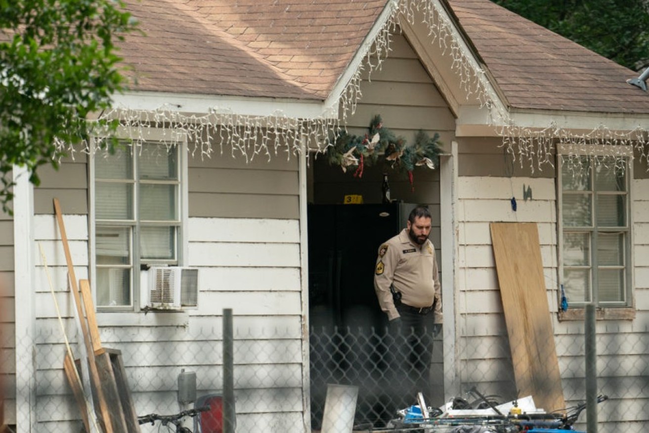 The house in Cleveland, Texas, where police found five of ten occupants dead.