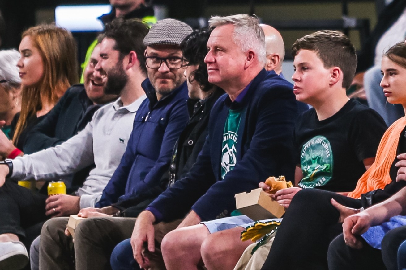Tasmanian Premier Jeremy Rockliff (centre) at the Tasmania JackJumpers NBL semi-finals clash in Hobart on Sunday. He has since confirmed his positive COVID test.