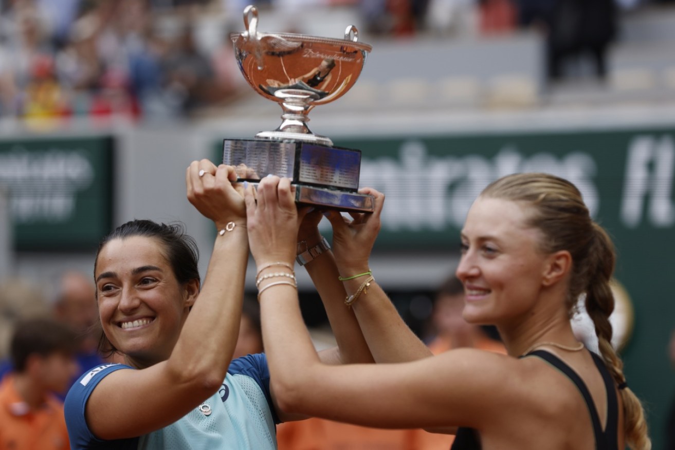 France's Caroline Garcia and Kristina Mladenovic celebrate their French Open doubles title on Sunday.