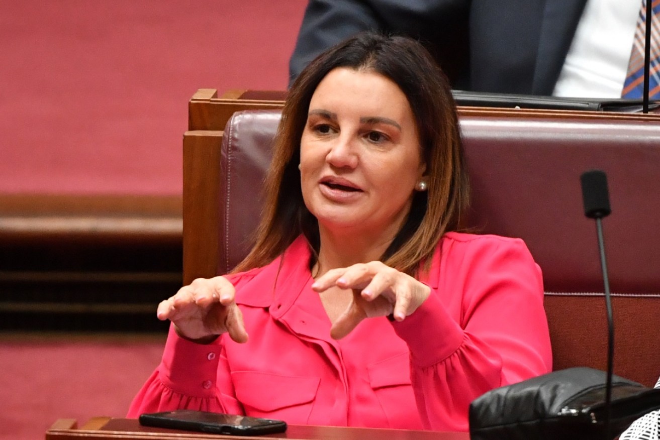 Two of Jacqui Lambie's ex-staffers who sued for unfair dismissal have to pay government court costs.