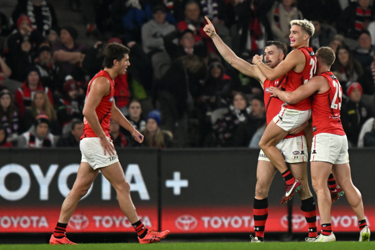 Watch the Bombers fly up! Sam Draper and Matt Guelfi celebrate another score in a six-goal blitz. <i>Photo: AAP</i>