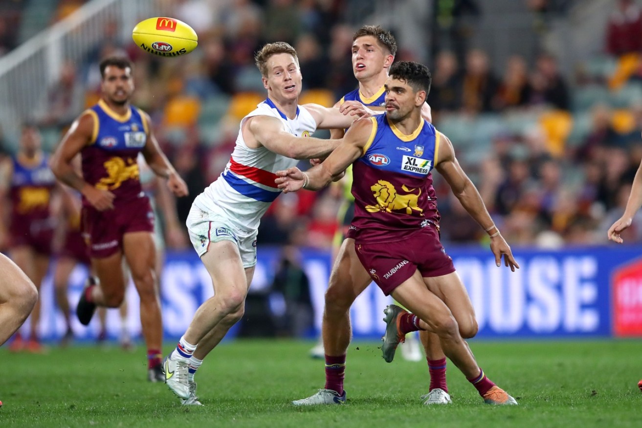 Livewire forward Charlie Cameron [right] excelled as Brisbane rallied to beat the Western Bulldogs at the Gabba.