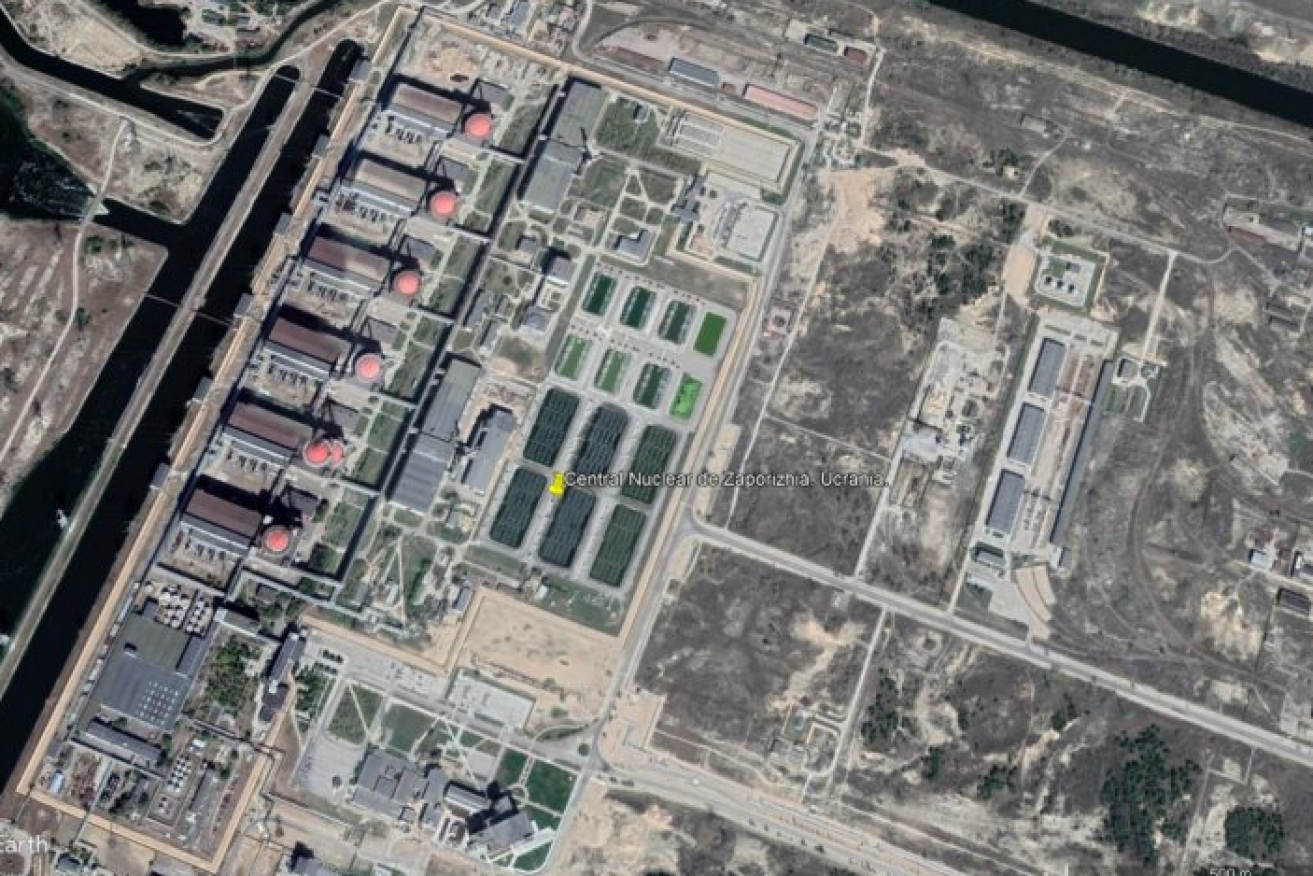 The Zaporizhzhia nuclear plant - the reactors are beneath the line of red roofs - is a sitting duck for incoming artillery. <i>Photo: Google Earth</i>
