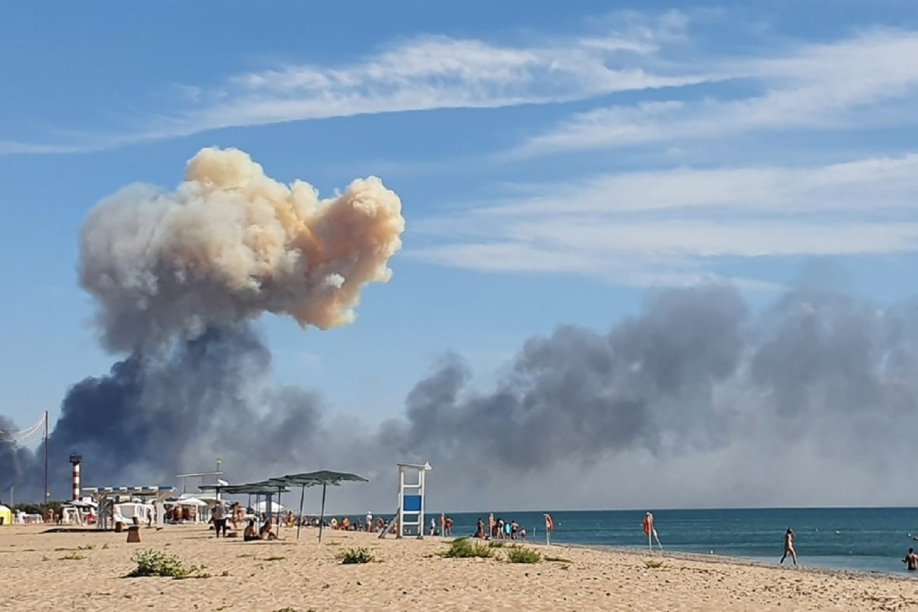 Smoke rises from a series of explosions at a Russian base in Crimea. <i>Photo: AAP</i>
