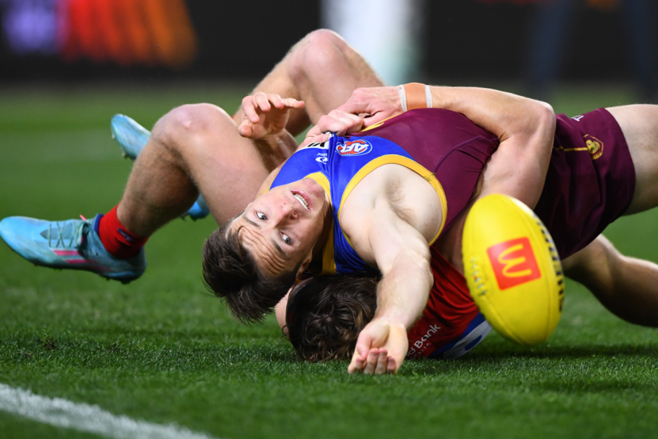 Like his Lions teammates throughout the night, Lincoln McCarthy has trouble getting his hands on the ball. <i>Photo: AAP</i>