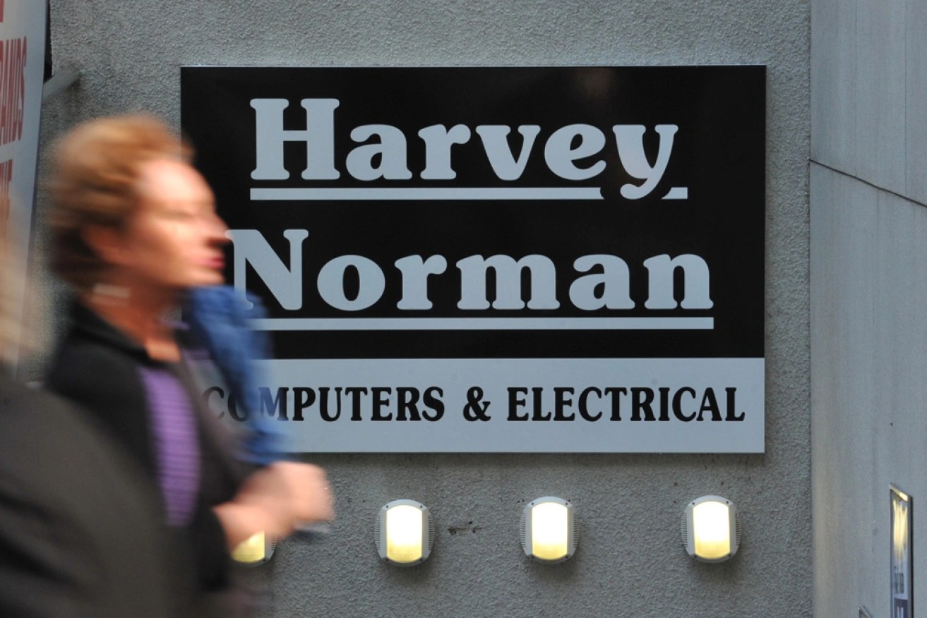 Harvey Norman has suffered a decline in net profits after its chief rival reported record earnings. 