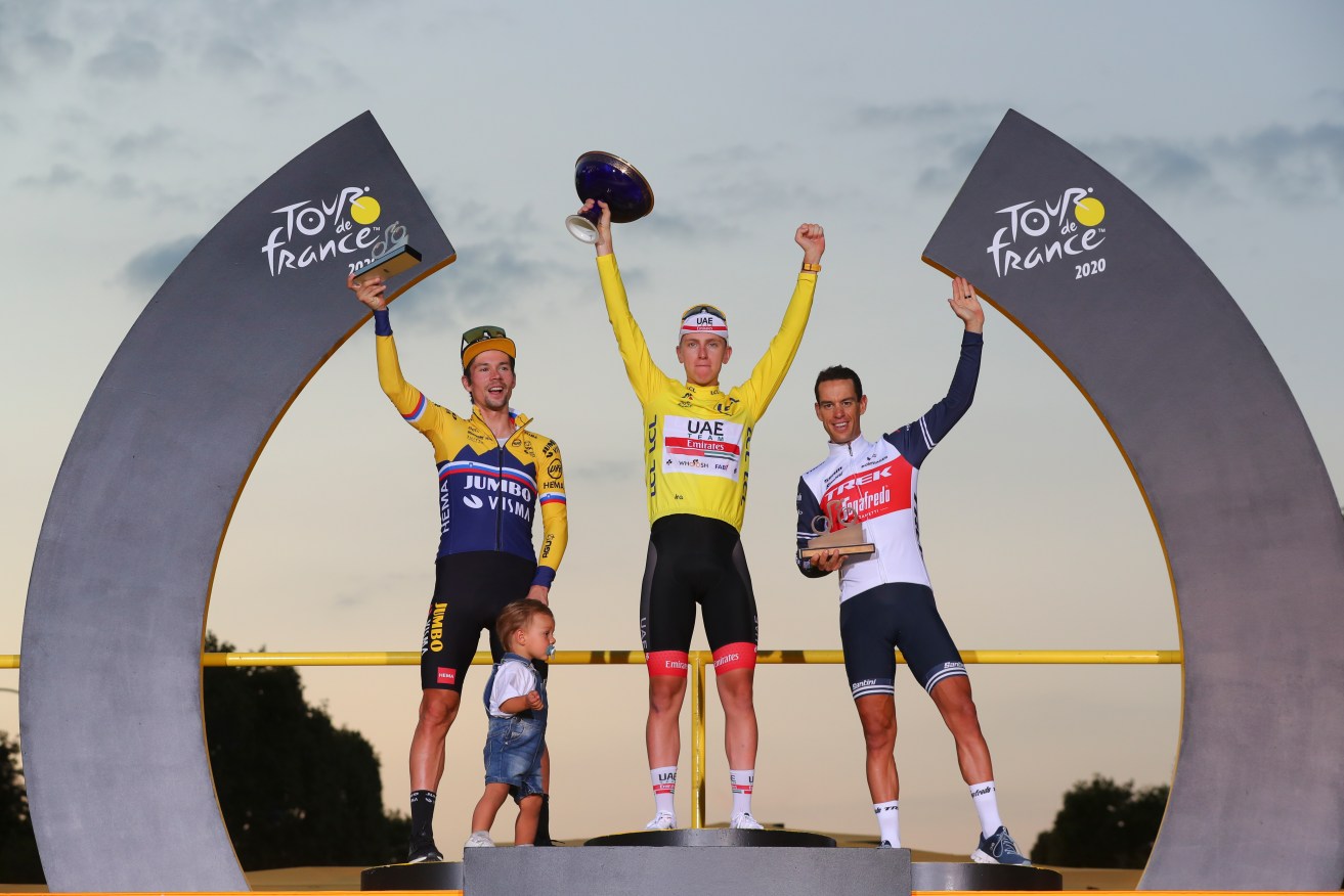 Richie Porte, right, celebrates his 2020 Tour de France finish with Tadej Pogacar and Primoz Roglic.